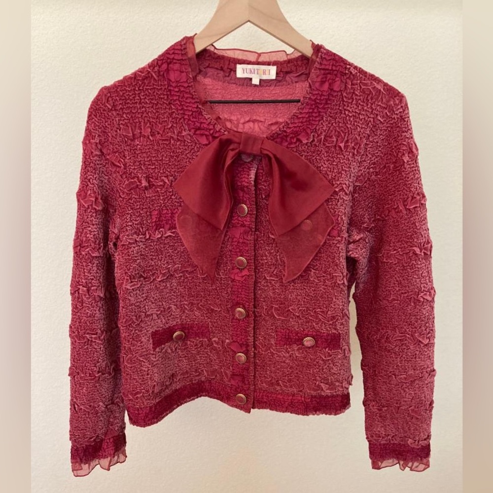 Rose colored silk comfortable jacket with pretty trims. Bow removable.